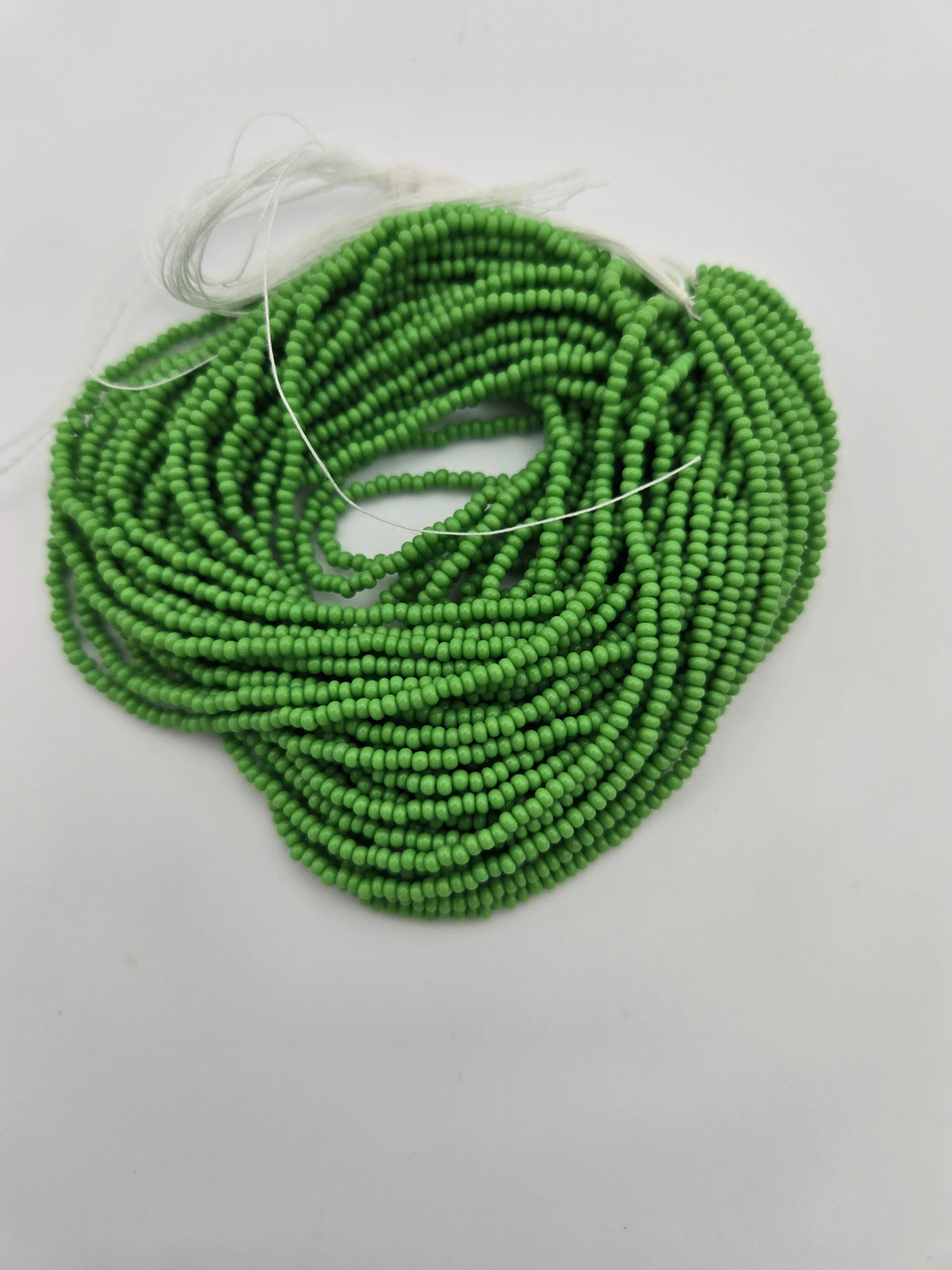 Czech 11/0 Op Light Green Strung