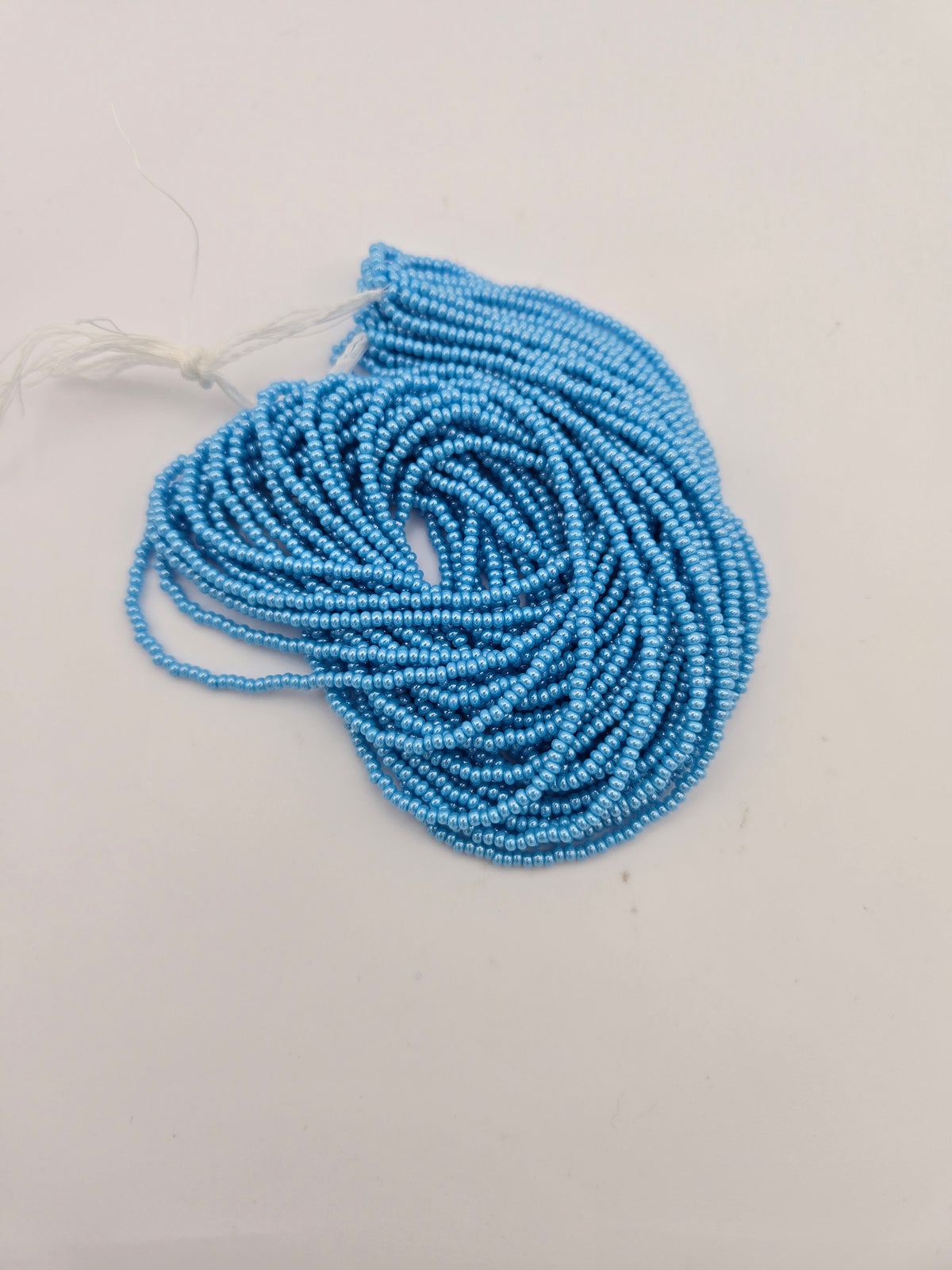 Czech 11/0 Op Lt Blue Luster Strung