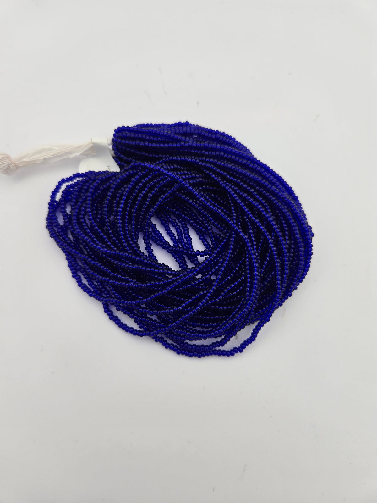 Czech Seed Bead 11/0 Transparent Royal Blue Strung