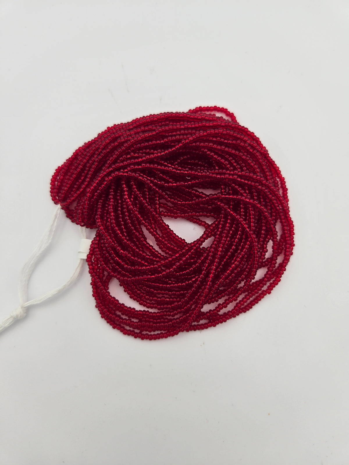 Czech Seed Bead 11/0 Transparent Red Strung