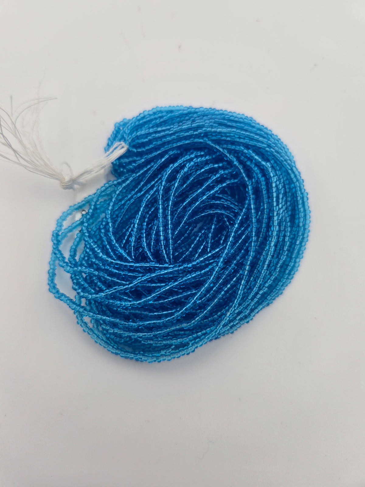 Czech Seed Bead 11/0 Transparent Light Aqua Strung