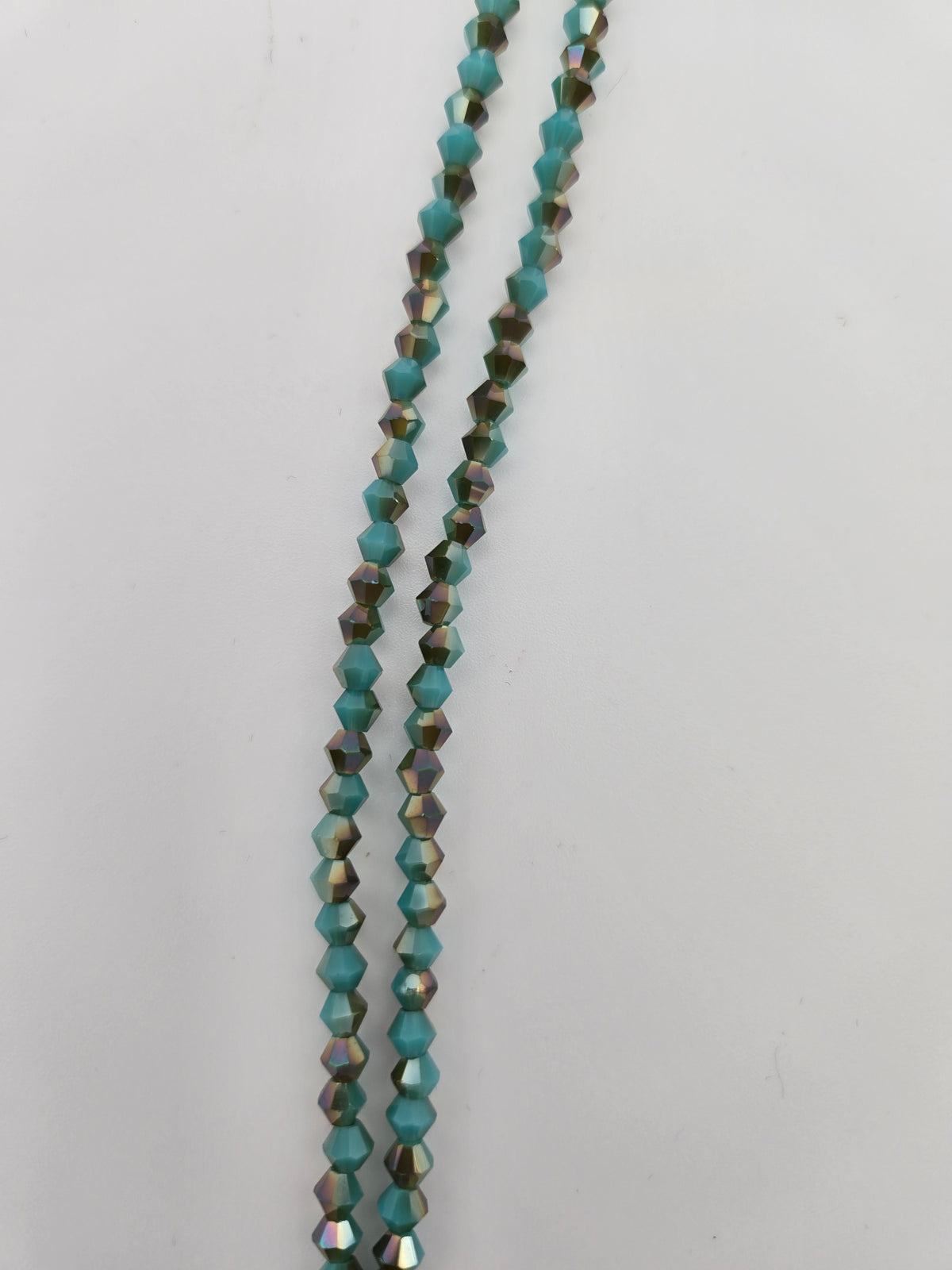 Bicone 4mm Op. Turquoise w/ Half Champagne Luster