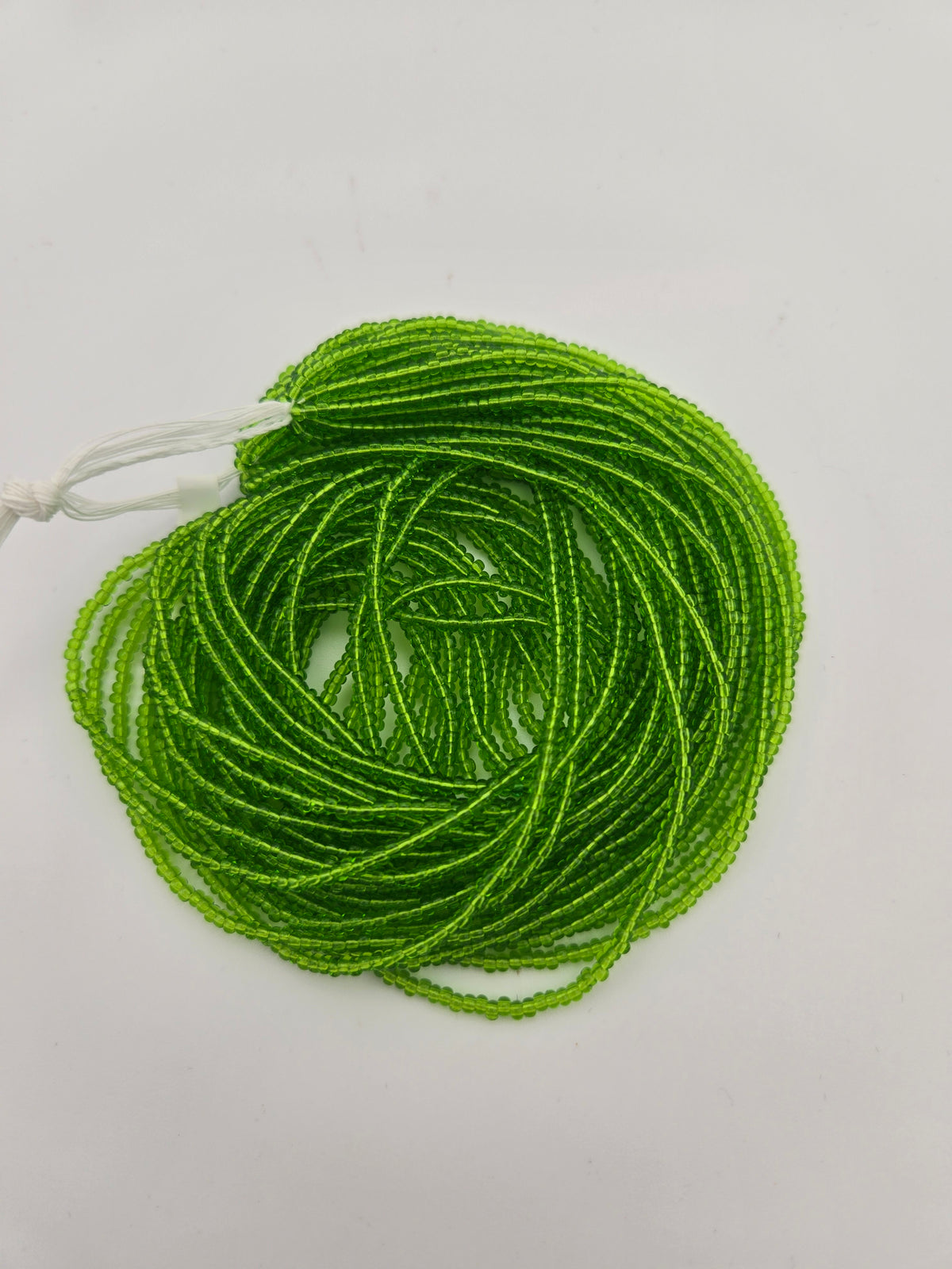 Czech Seed Bead 11/0 Transparent Chartreuse Strung