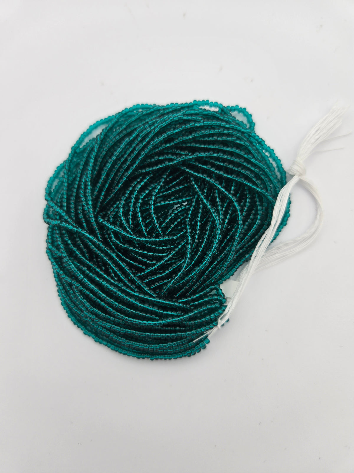 Czech Seed Bead 11/0 Transparent Teal Green Strung