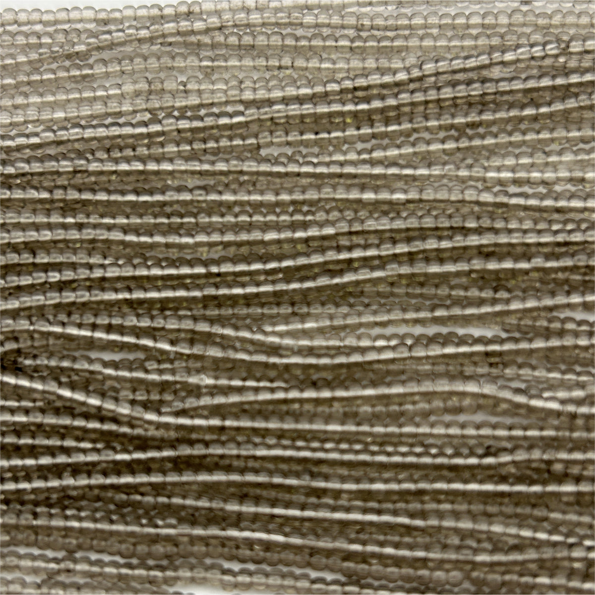 Czech Seed Bead 11/0 Transparent Grey Strung