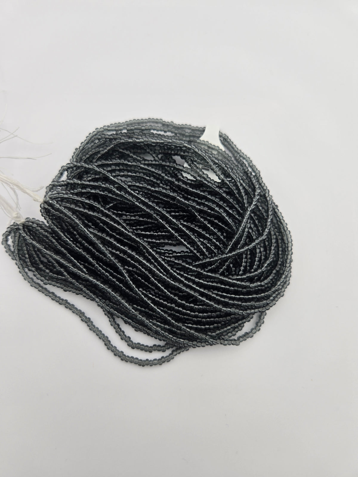 Czech Seed Bead 11/0 Transparent Grey Strung