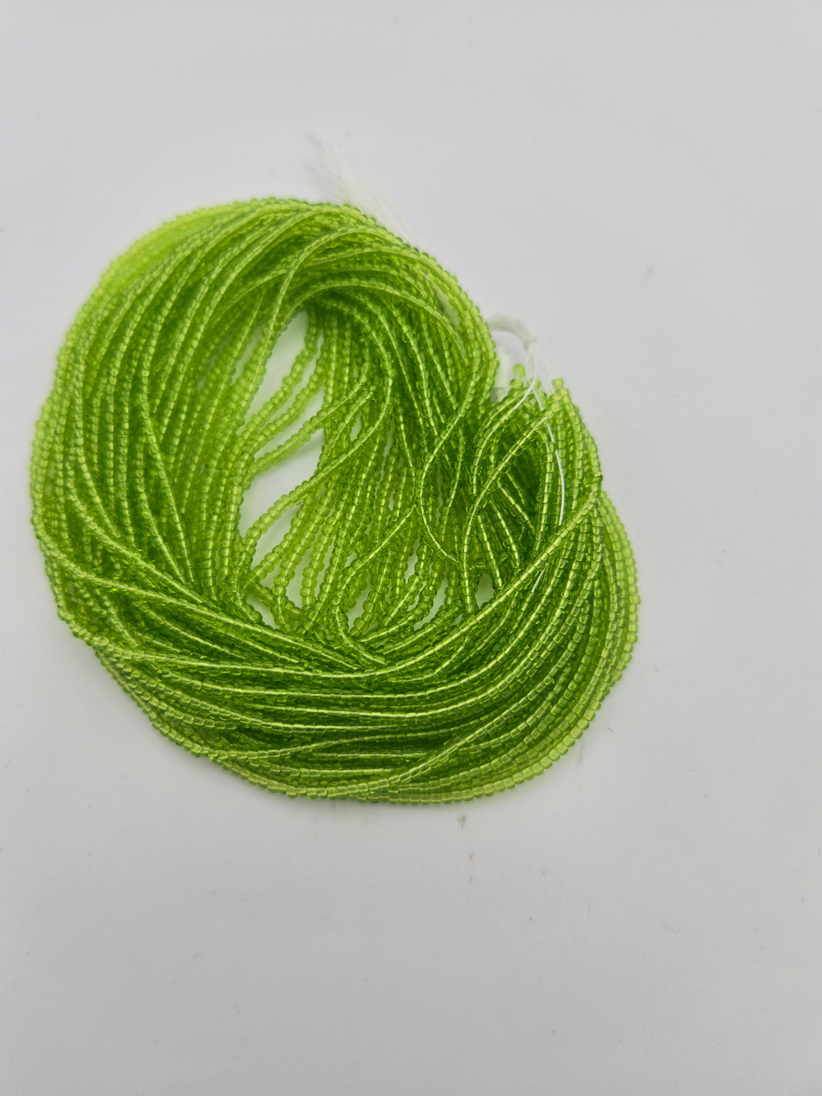 Czech Seed Bead 11/0 Tr Light Green Strung