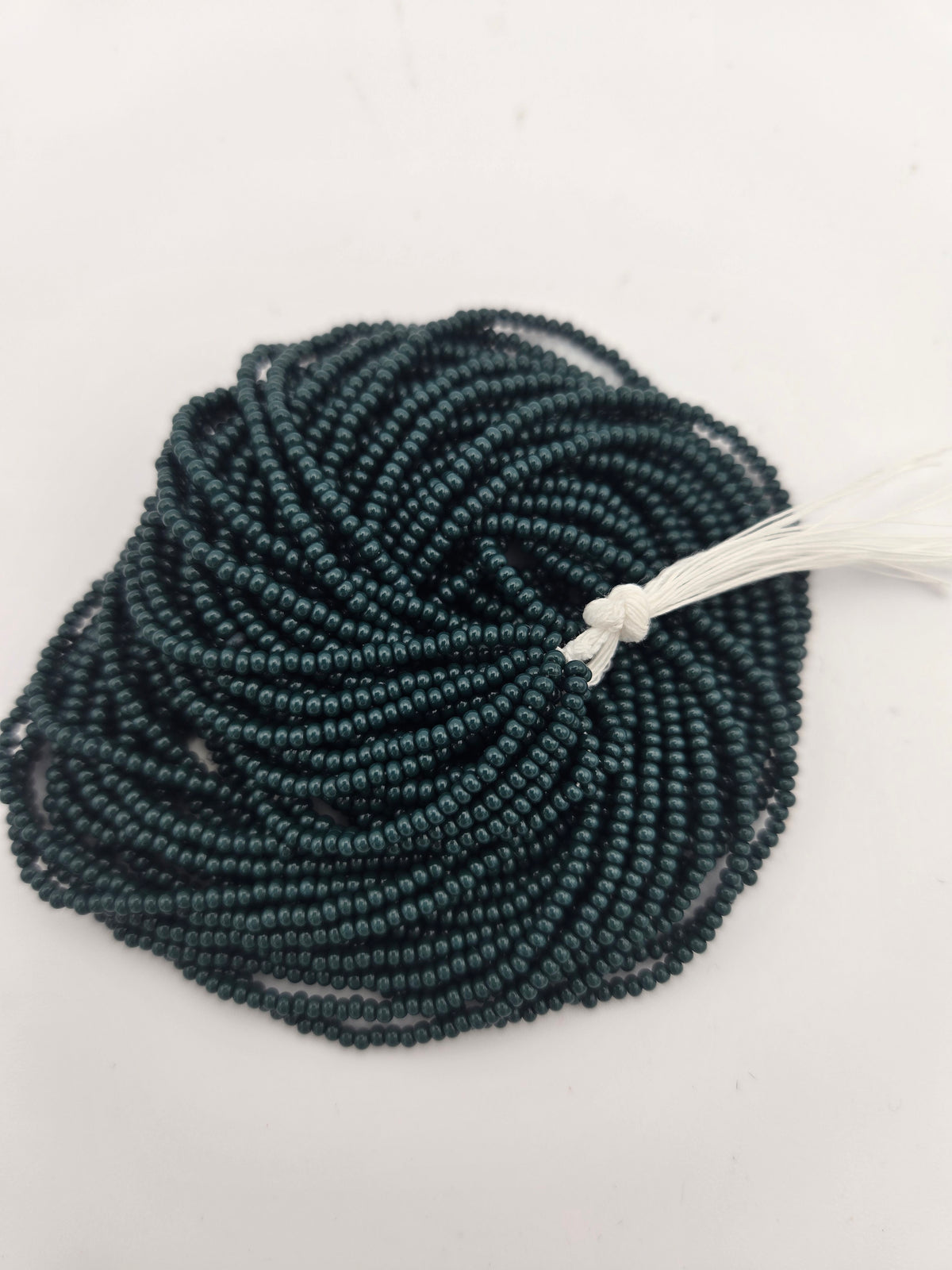 Czech Seed Bead 11/0 Op Dark Green Natural Strung