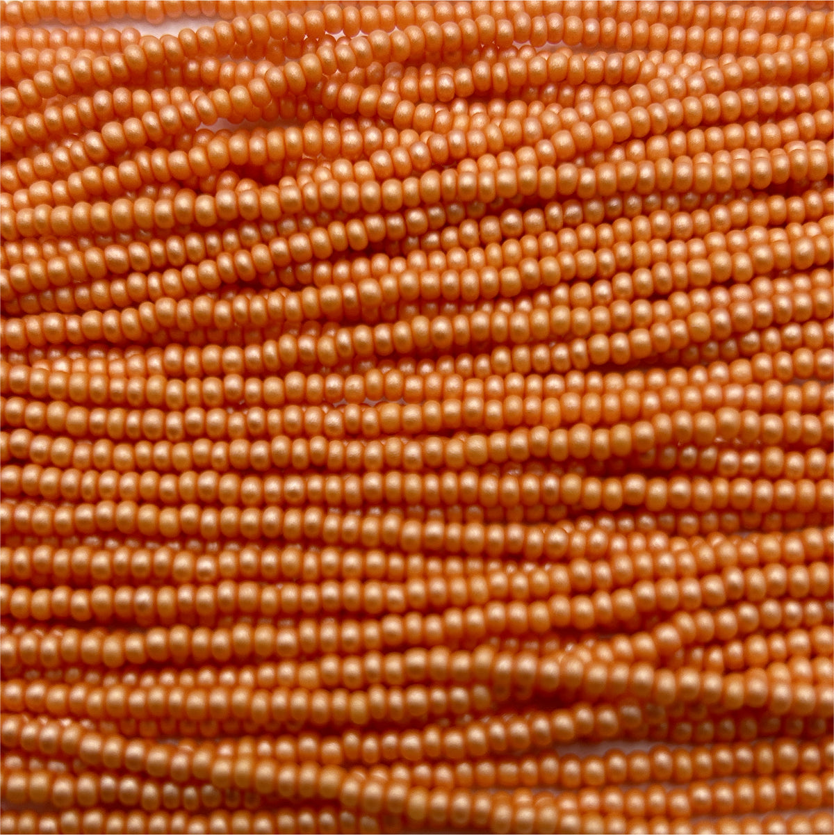Czech 11/0 PermaLux Dyed Chalk Apricot Strung