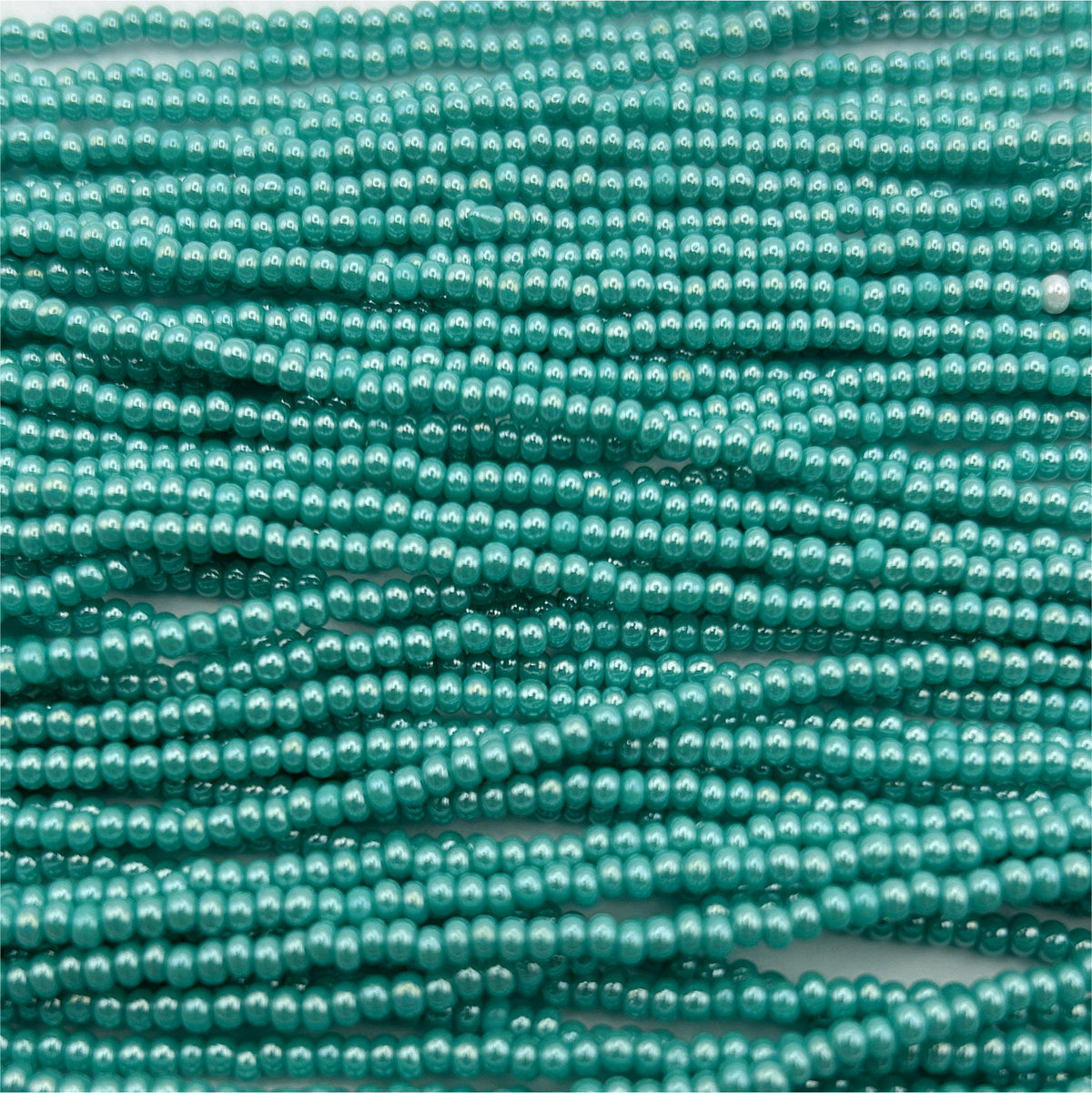 Czech Seed Bead 11/0 Op Turquoise luster Strung
