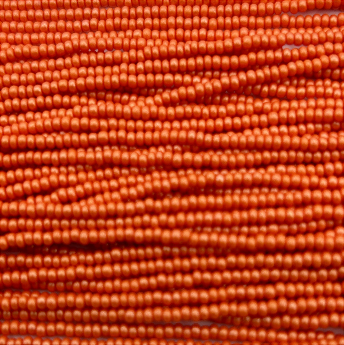 Czech 11/0 PermaLux Dyed Chalk Orange Strung