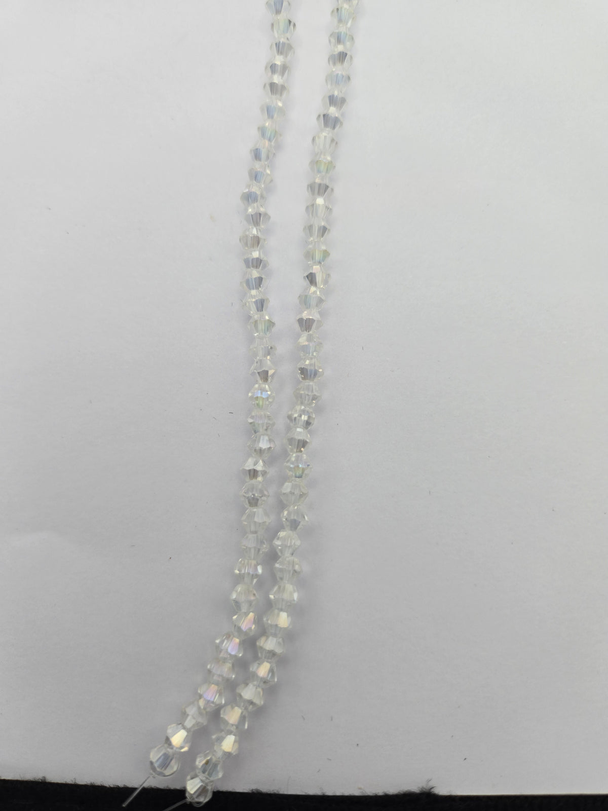 Bicone 4mm Tr. Crystal AB