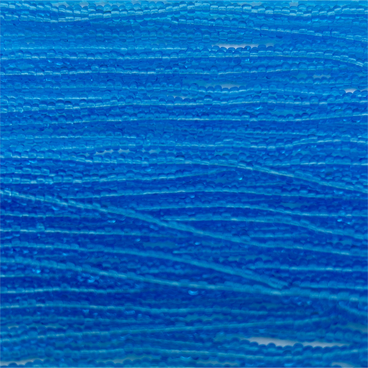 Czech Seed Bead 11/0 Transparent Light Aqua Strung