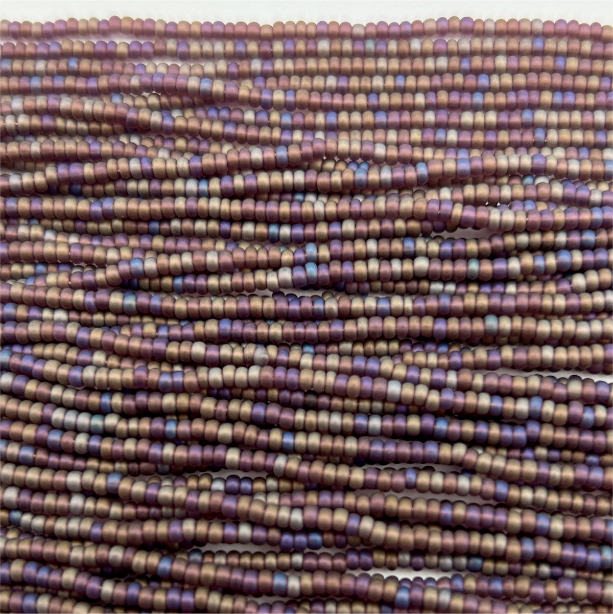 Czech Seed Bead 11/0 Transparent Mauve Matt AB Strung