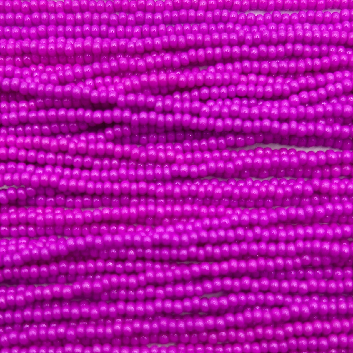 Czech Seed Bead 11/0 Op Dyed Fuchsia Strung