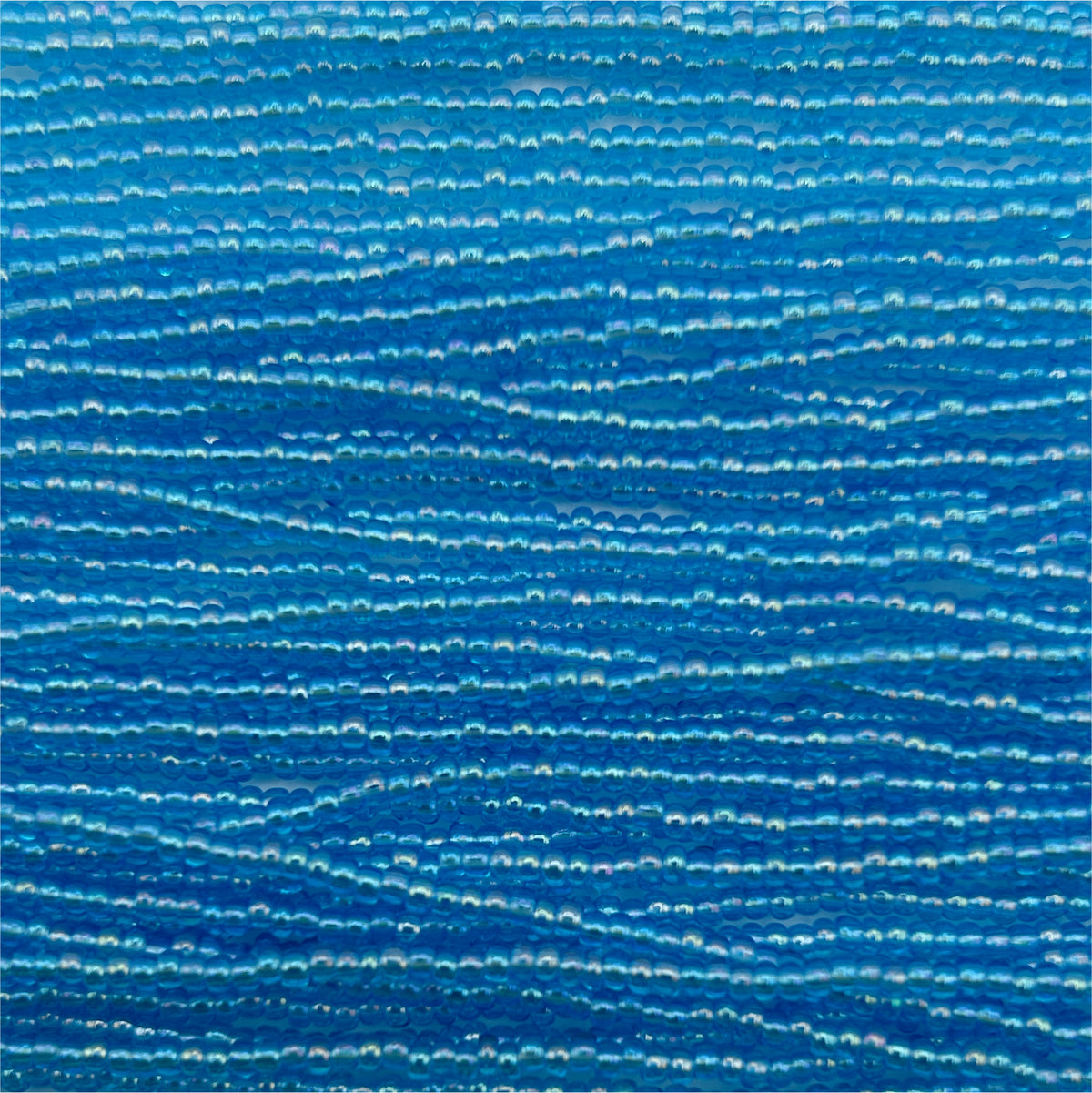 Czech Seed Bead 11/0 Transparent Aqua AB Strung