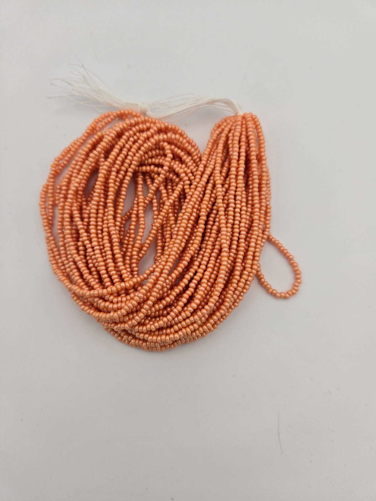 Czech 11/0 PermaLux Dyed Chalk Apricot Strung